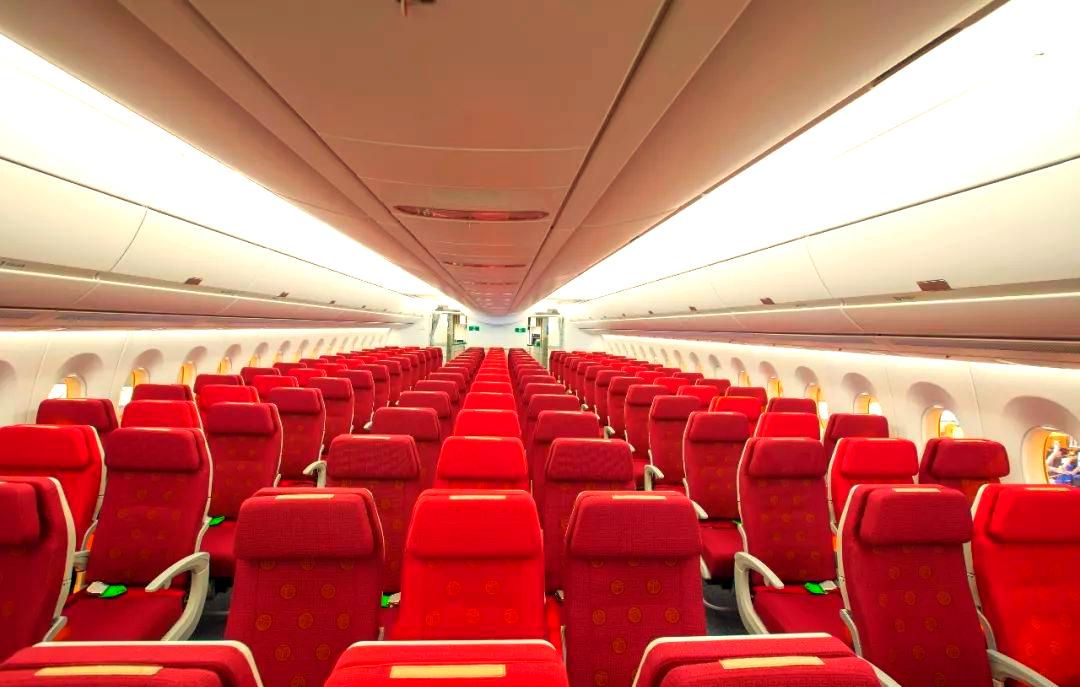 Hong Kong Airlines cabin interior with red seats